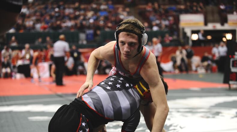 Carlisle High School junior Justin Ritchie competed took to the mat Thursday at the state wrestling championships at Ohio State University’s Schottenstein Center. Ritchie, wrestling in the 126-pound weight class in Division III, lost his opening-round match 28-12 to Akron Manchester senior Zach Larue. Greg Billing/CONTRIBUTED