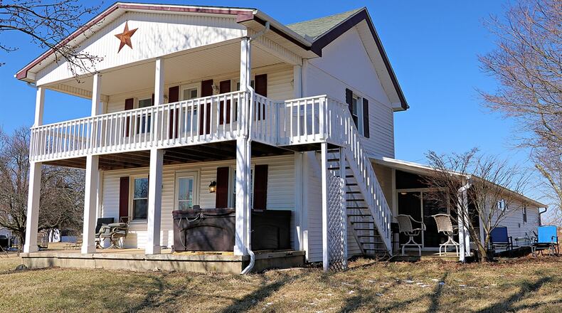 Built in 1919, the reimagined living space in this farmhouse features two bedrooms that walk out to covered porches, a galley kitchen with plenty of preparation space and two updated bathrooms. CONTRIBUTED PHOTOS