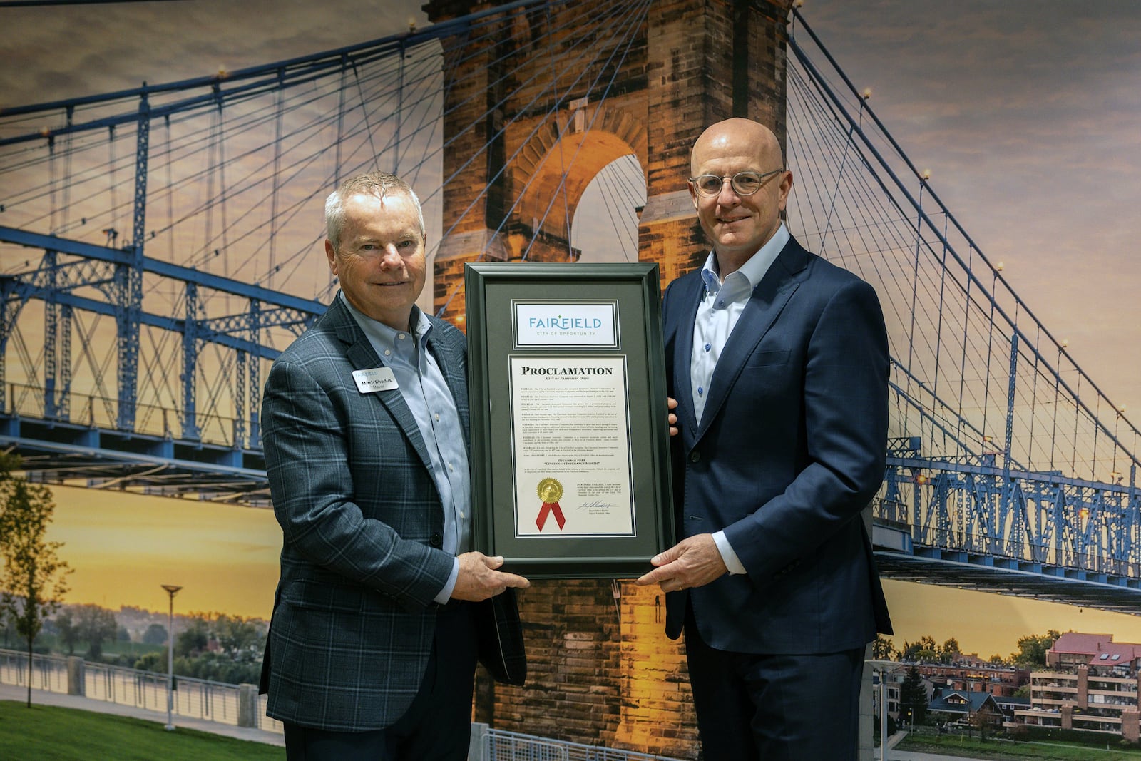 Fairfield Mayor Mitch Rhodus presented Steve Spray, president and chief executive officer of Cincinnati Financial Corp., a proclamation declaring December Cincinnati Insurance month in recognition of the company's 75th year in business - it's 40th year in Fairfield. CITY OF FAIRFIELD/CONTRIBUTED