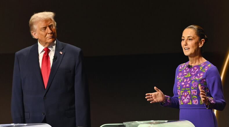 FILE - U.S. President Donald Trump looks on as Mexican President Claudia Sheinbaum speaks on stage at the draw for the 2026 soccer World Cup at the Kennedy Center in Washington, Dec. 5, 2025. (Mandel Ngan/Pool Photo via AP, File)