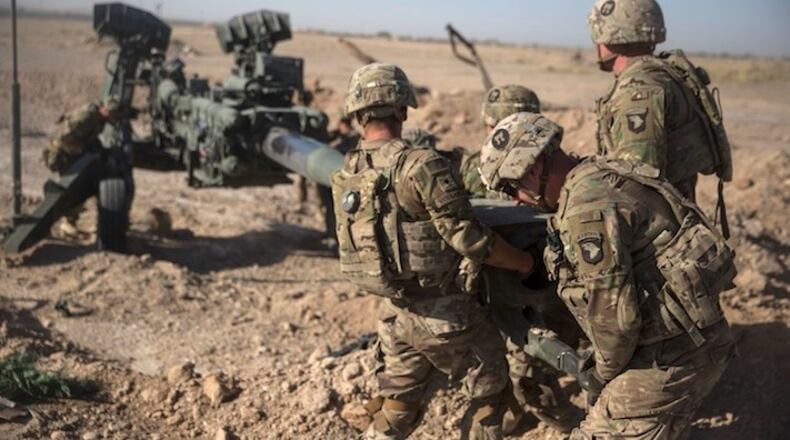 In this June 10, 2017 photo provided by Operation Resolute Support, U.S. Soldiers with Task Force Iron maneuver an M-777 howitzer, so it can be towed into position at Bost Airfield, Afghanistan. Reversing his past calls for a speedy exit, U.S. President Donald Trump recommitted the United States to the 16-year-old war in Afghanistan Monday night, Aug. 21, 2017, declaring U.S. troops must "fight to win." He pointedly declined to disclose how many more troops will be dispatched to wage America's longest war. (U.S. Marine Corps photo by Sgt. Justin T. Updegraff, Operation Resolute Support via AP, File)