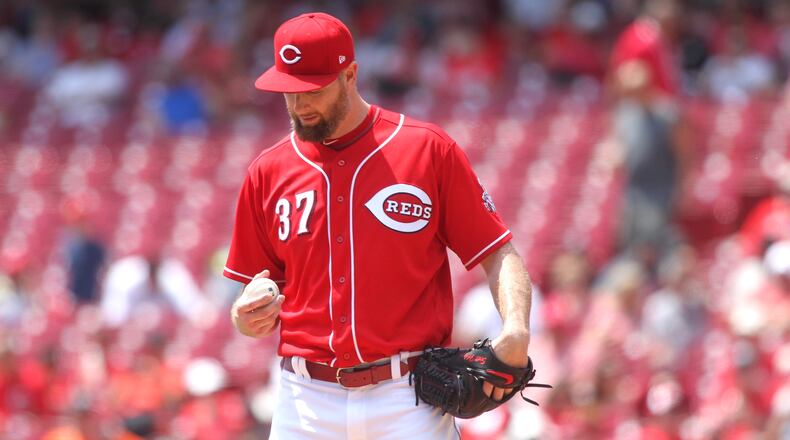 Reds pitcher Scott Feldman eyes the baseball during a start against the Nationals on Sunday, July 16, 2017, at Great American Ball Park in Cincinnati.