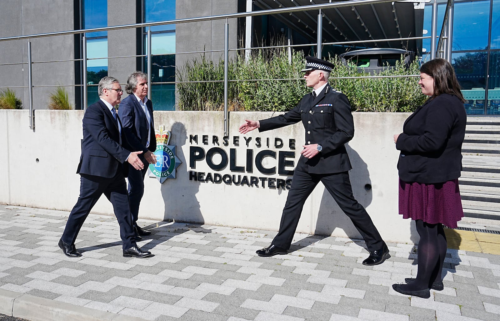 Britain's Prime Minister Keir Starmer, left, meets with Police and Crime Commissioner Emily Spurrell, right, Deputy Chief Constable Chris Green, second right, and the Mayor of Liverpool City Region, Steve Rotheram, at Merseyside Police Headquarters, in Liverpool, England, Wednesday, May 28, 2025. (Peter Byrne/Pool photo via AP)
