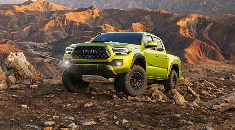This photo provided by Toyota Motor Sales U.S.A. shows the 2022 Toyota Tacoma. It excels at off-roading capability and comes in a wide variety of configurations. (Courtesy of Toyota Motor Sales U.S.A. via AP)