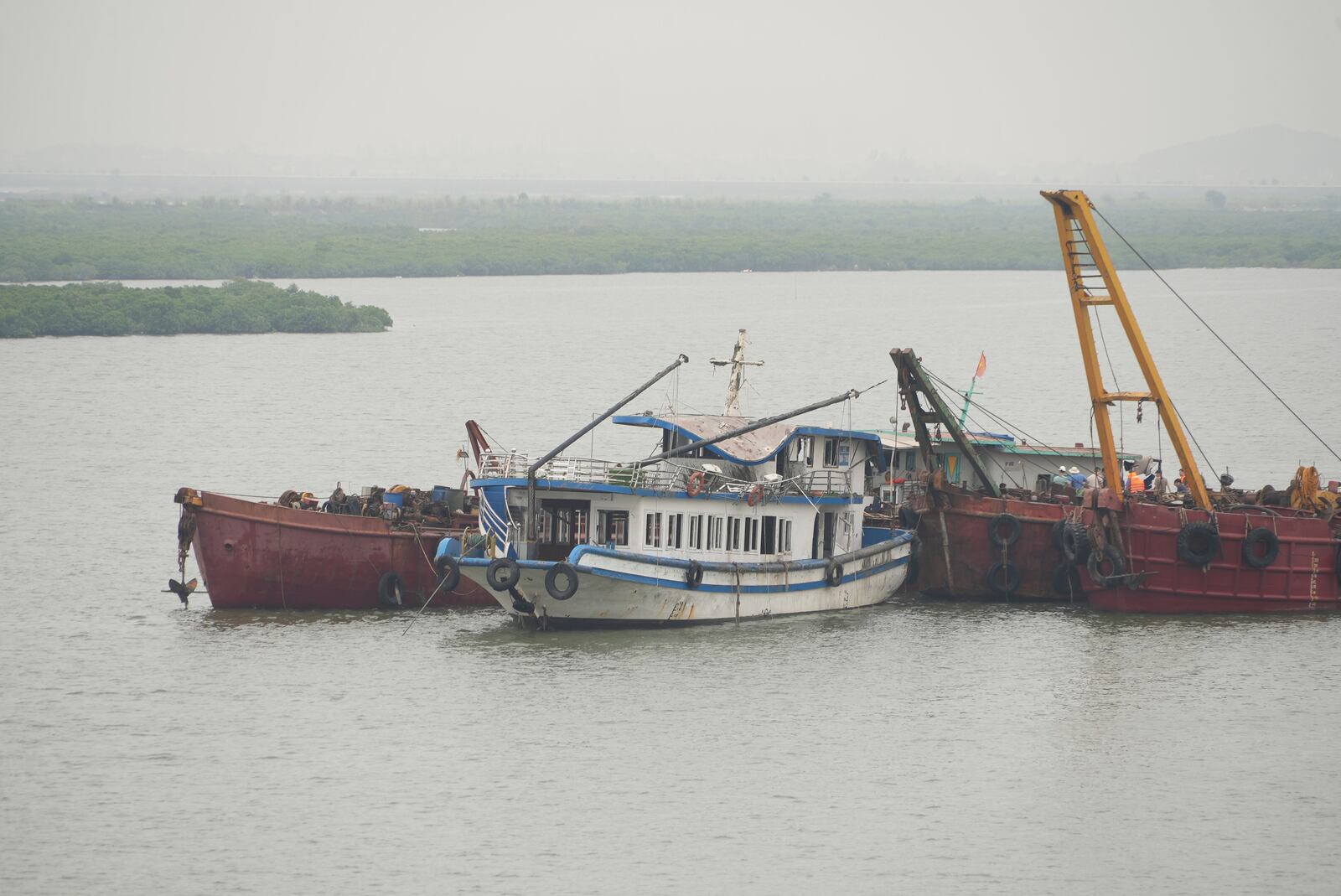 Tourist boat Wonder Sea is towed to a shipyard for investigation after its capsizing, which killed multiple people, in a thunderstorm in Ha Long Bay, Vietnam Sunday, July 20, 2025. (AP Photo/Huy Han)
