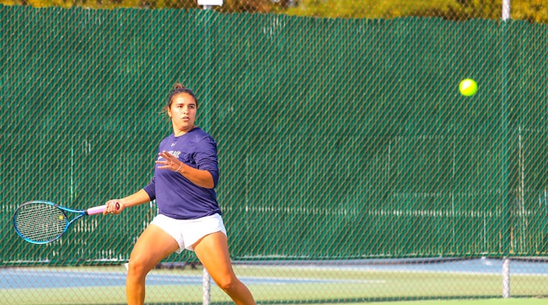 Diana Ivanikhina – the No. 1 singles player on the Cedarville University tennis team who has won both All-G-MAC tennis honors and G-MAC All Academic honors – in action for the Yellow Jackets. She has one the of the most incredible hardship-to-glory stories in college sports. MEGAN STRUNK / CEDARVILLE UNIVERSITY