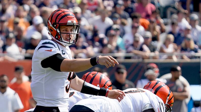 Cincinnati Bengals quarterback Joe Burrow calls a play at the line of scrimmage during the first half of an NFL football game against the Chicago Bears Sunday, Sept. 19, 2021, in Chicago. (AP Photo/Nam Y. Huh)