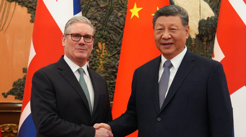 British Prime Minister Keir Starmer, left, shakes hands with Chinese President Xi Jinping ahead of a meeting in Beijing Thursday, Jan. 29, 2026. (Carl Court/Pool Photo via AP)
