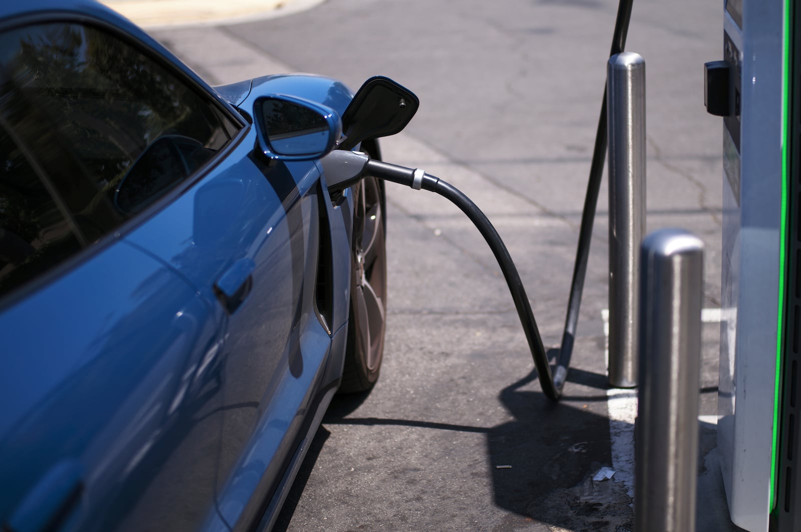 FILE - An electric vehicle charges at an Electrify America station in Arcadia, Calif., May 22, 2025. (AP Photo/Jae C. Hong, File)