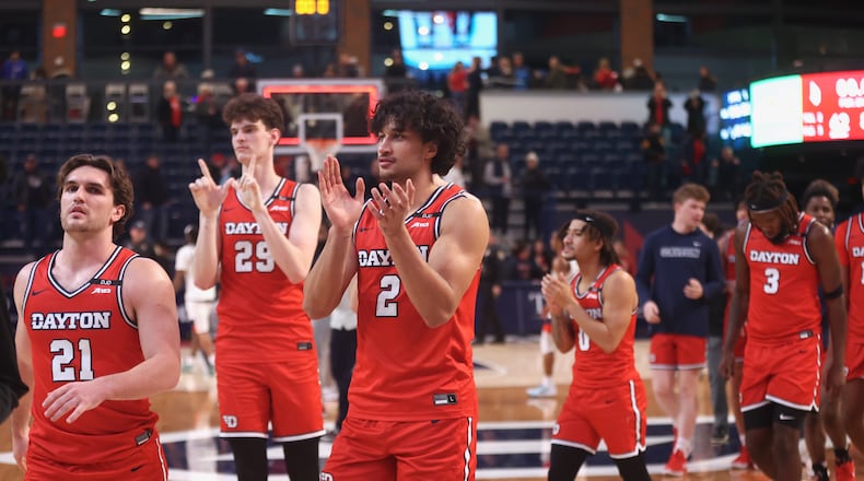 Dayton players, including Nate Santos, center, leave the court after a victory against Duquesne on Tuesday, Jan. 21, 2025, at the UPMC Cooper Fieldhouse in Pittsburgh. David Jablonski/Staff