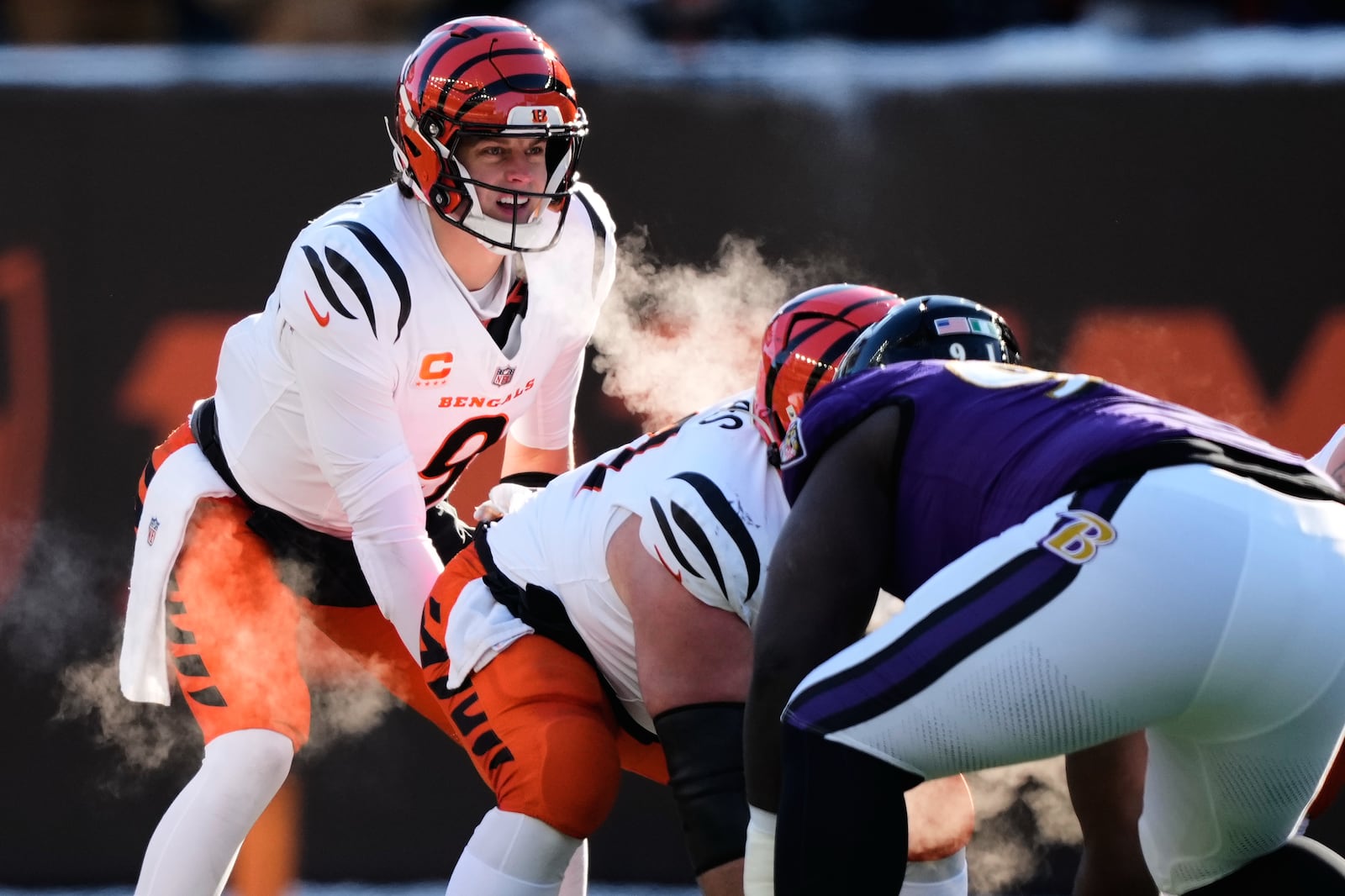 Cincinnati Bengals quarterback Joe Burrow (9) calls the cadence during the first half of an NFL football game against the Baltimore Ravens, Sunday, Dec. 14, 2025, in Cincinnati. (AP Photo/Carolyn Kaster)