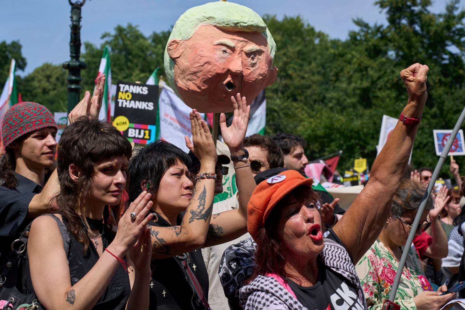 A puppet of U.S. President Donald Trump is held up during a demonstration ahead of the NATO summit in The Hague, Netherlands, Sunday, June 22, 2025. (AP Photo/Peter Dejong)