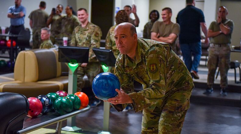 Col. Patrick Miller, 88th Air Base Wing and installation commander, prepares to throw a ball down the lane during the Eagles vs. Chiefs Bowling Challenge at Wright-Patterson Air Force Base on April 11. The three-game tournament pitted 88 ABW’s colonels against chief master sergeants and senior enlisted leaders. The Chiefs won the final matchup 109-77. U.S. AIR FORCE PHOTO/SENIOR AIRMAN JACK GARDNER