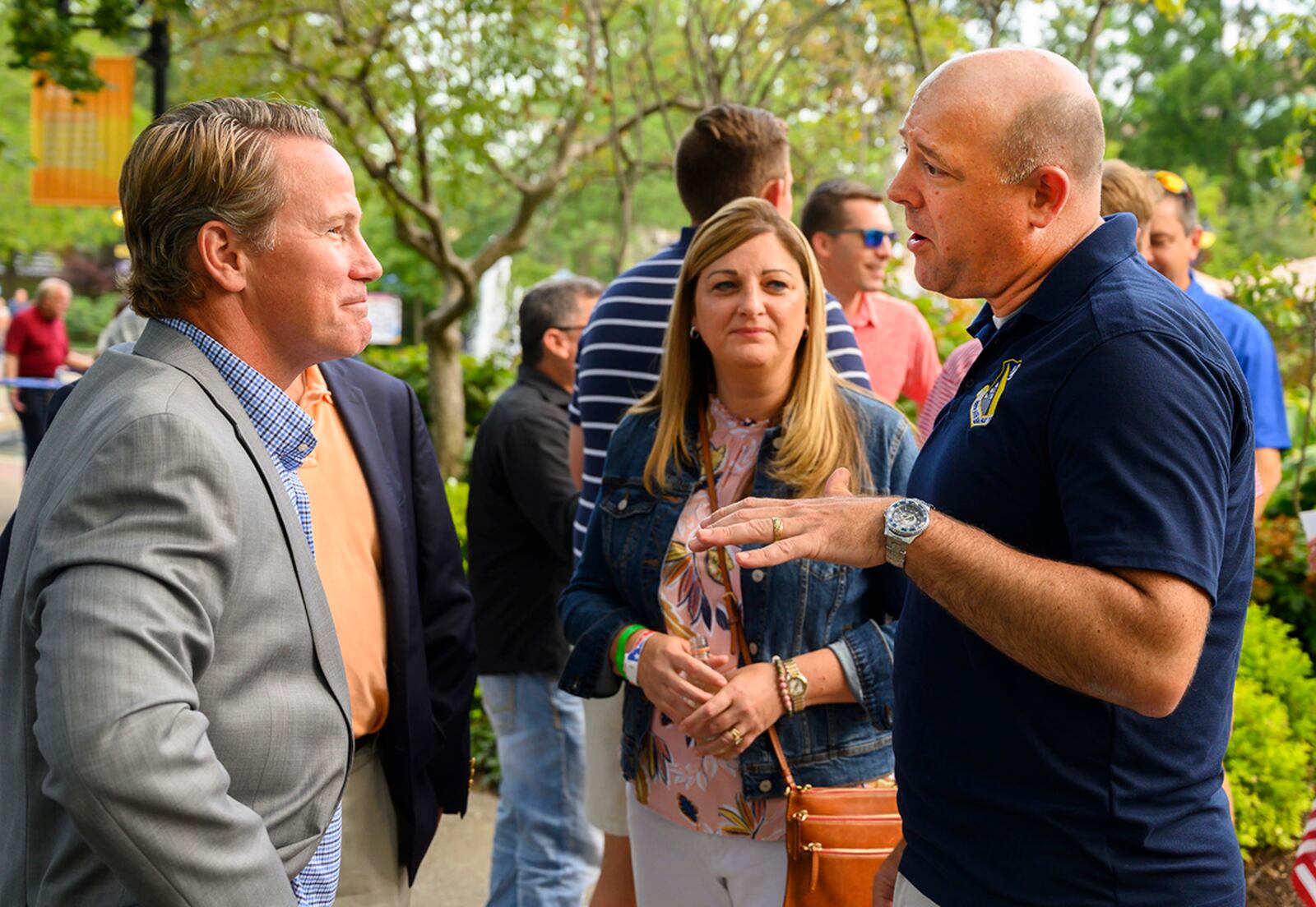 Col. Patrick Miller (right), 88th Air Base Wing and Wright-Patterson Air Force Base commander, alongside his wife, Beth, visits with Ohio Lt. Gov. Jon Husted at a reception prior to the Dayton Development Coalition’s Hometown Heroes event Aug. 5 at Fraze Pavilion in Kettering. U.S. AIR FORCE PHOTO/R.J. ORIEZ