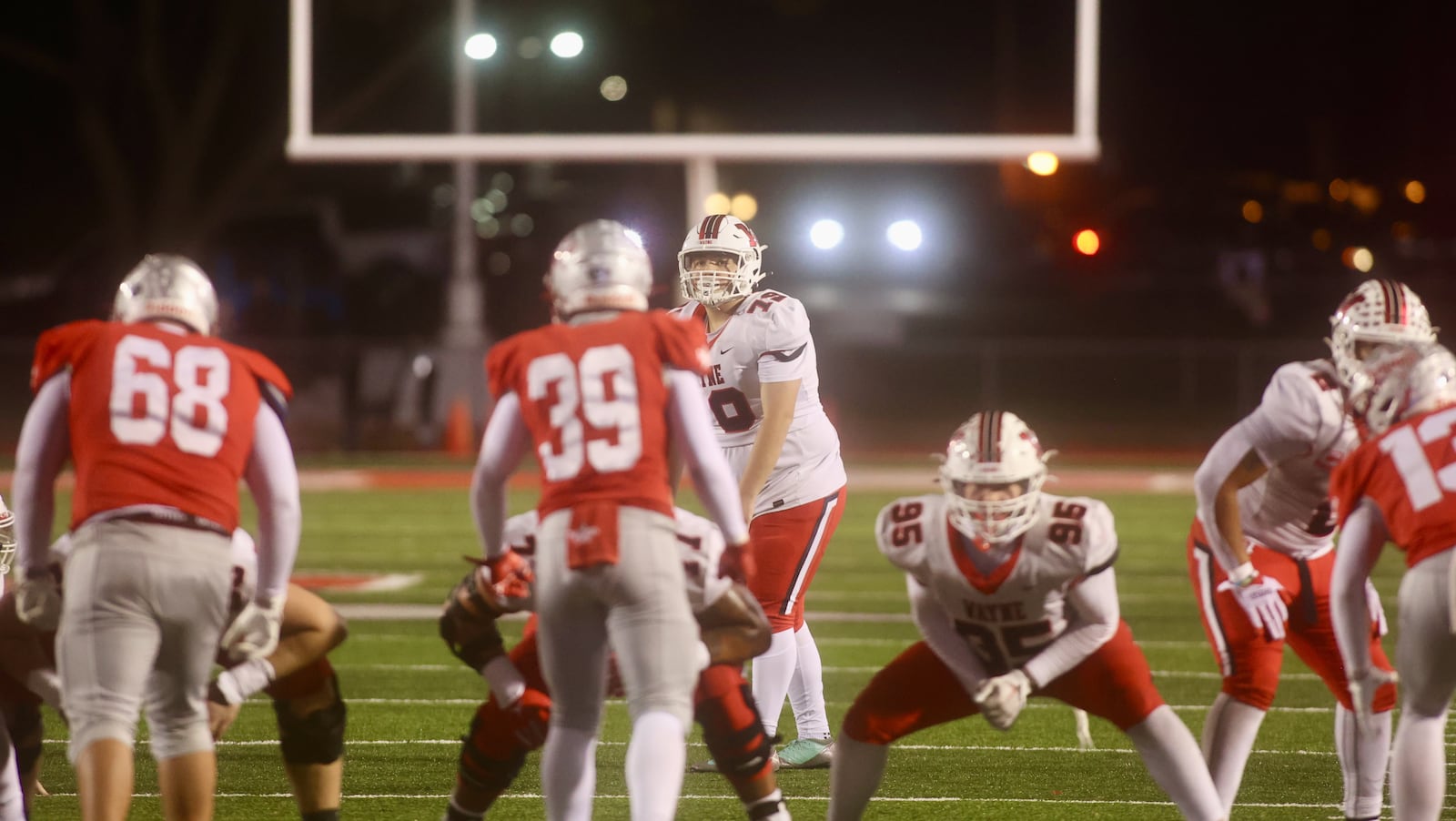 Wayne's Jayden Heinrich prepares to attempt a field goal in the fourth quarter against Troy in a Division I, Region 2 semifinal on Friday, Nov. 14, 2025, at Troy Memorial Stadium. David Jablonski/Staff
