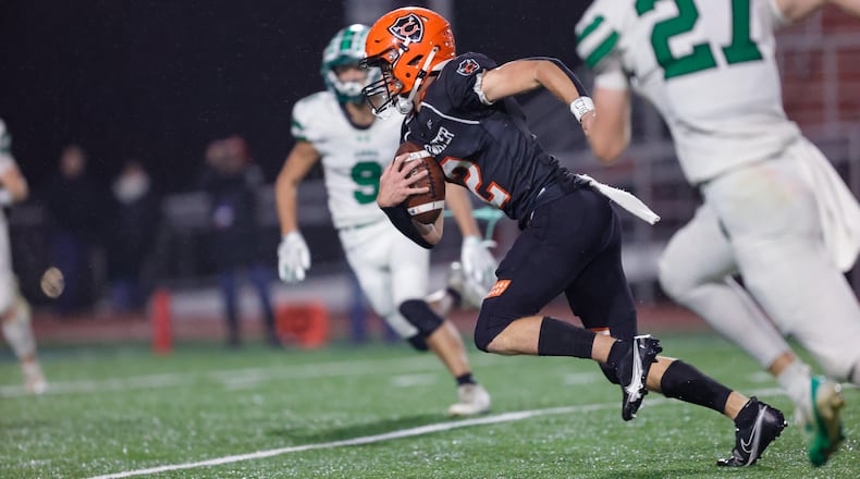 Coldwater High School senior Caleb Schroer runs with the ball during their game against Anna on Friday, Nov. 21, 2025, at Piqua's Alexander Stadium. The Cavaliers won 14-12 to win the Division VI, Region 24 final. MICHAEL COOPER / STAFF PHOTO