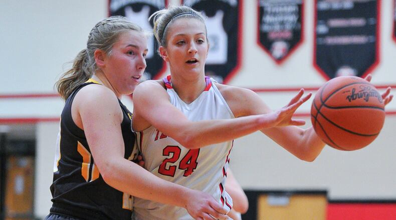 Tecumseh’s Presley Griffitts passes with pressure from Alter’s Emily Long during a nonconference game on Monday night at Reynolds Gymnasium. Bryant Billing/Contributed