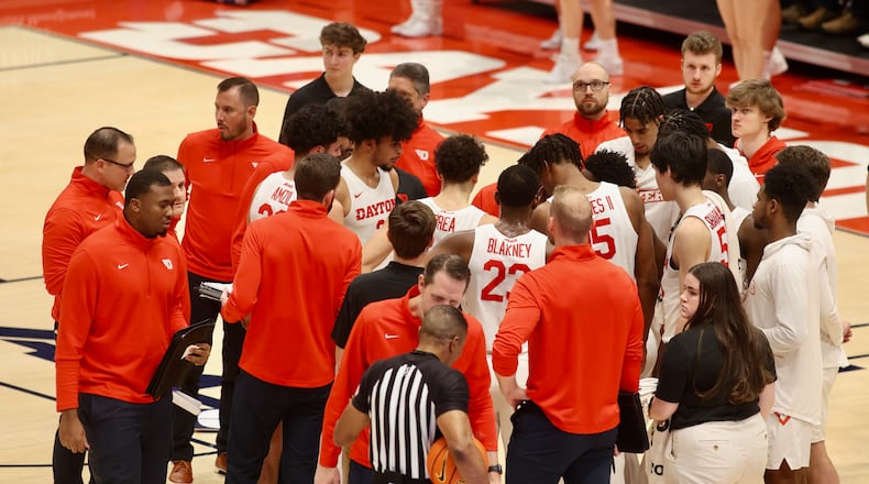 Dayton huddles during a game against Loyola on Tuesday, Jan. 31, 2023, at UD Arena. David Jablonski/Staff