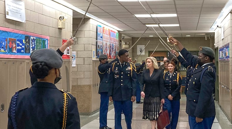 FILE - Army Secretary Christine Wormuth is greeted at the Chicago Military Academy as she heads into meetings with young members of the Reserve Officers' Training Corps in Chicago, on Feb. 15, 2023. The Army and Air Force say they are on track to meet their recruiting goals in 2024, reversing previous shortfalls using a swath of new programs and policy changes. But the Navy, while improving, expects once again to fall short. (AP Photo/Lolita Baldor, File)