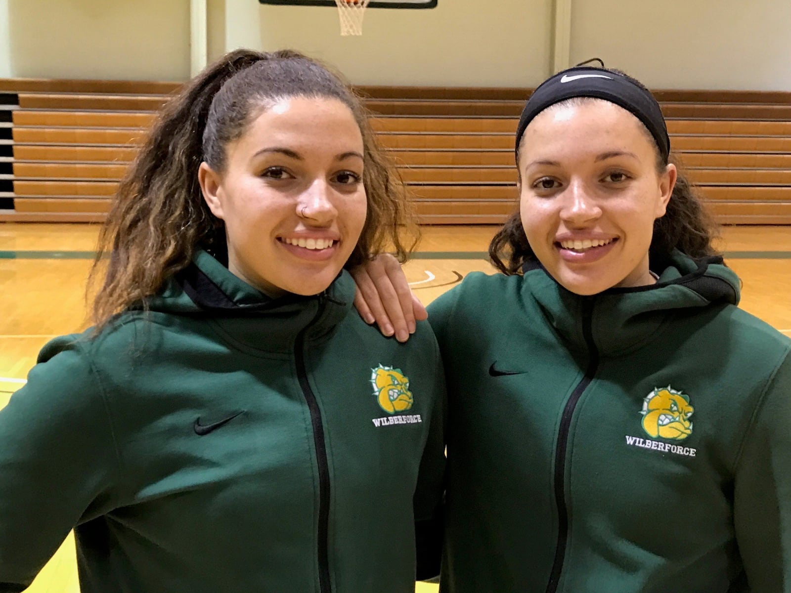Twin sisters Alexandra Shealey (left) and sister Alexis. The Middletown High grads are junior guards on the Wilberforce Bulldogs basketball team. Tom Archdeacon/STAFF
