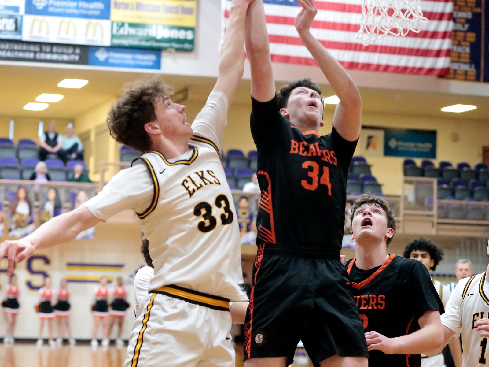 Beavercreek junior Jake Paddo tries to outleap Beavercreek freshman Jake Lanning during a 62-27 Centerville win over Beavercreek in the Division I district semifinals Thursday, March 5, 2026, in Vandalia. STEVEN WRIGHT / STAFF