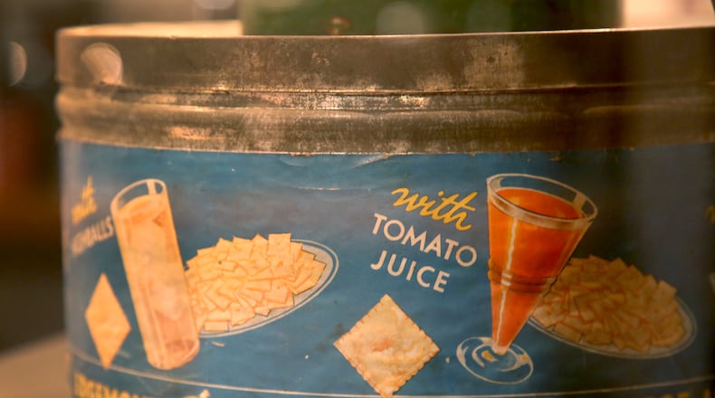 The Cheez-It cracker was invented in Dayton in 1921 by the Greene & Greene Company. This snack can, circa 1929, is on display at Carillon Historical Park. LISA POWELL / DAYTON DAILY NEWS