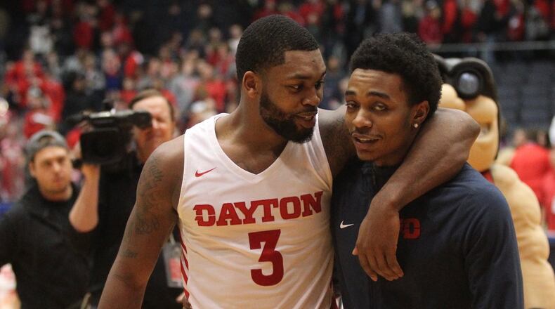 Dayton’s Trey Landers and Rodney Chatman leave the court after a victory against Massachusetts on Sunday, Jan. 13, 2019, at UD Arena. David Jablonski/Staff