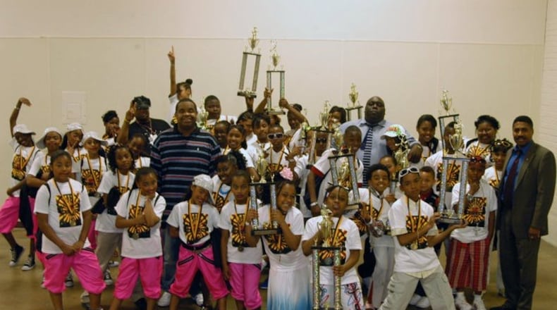 Dayton promoter Tommy Owens Jr. (man in striped shirt) is pictured with former winners and participants in the Family Affair Talent Show. The other adults in the photo are comedian Faizon Love and Ohio Rep. Fred Strahorn, D-Dayton.