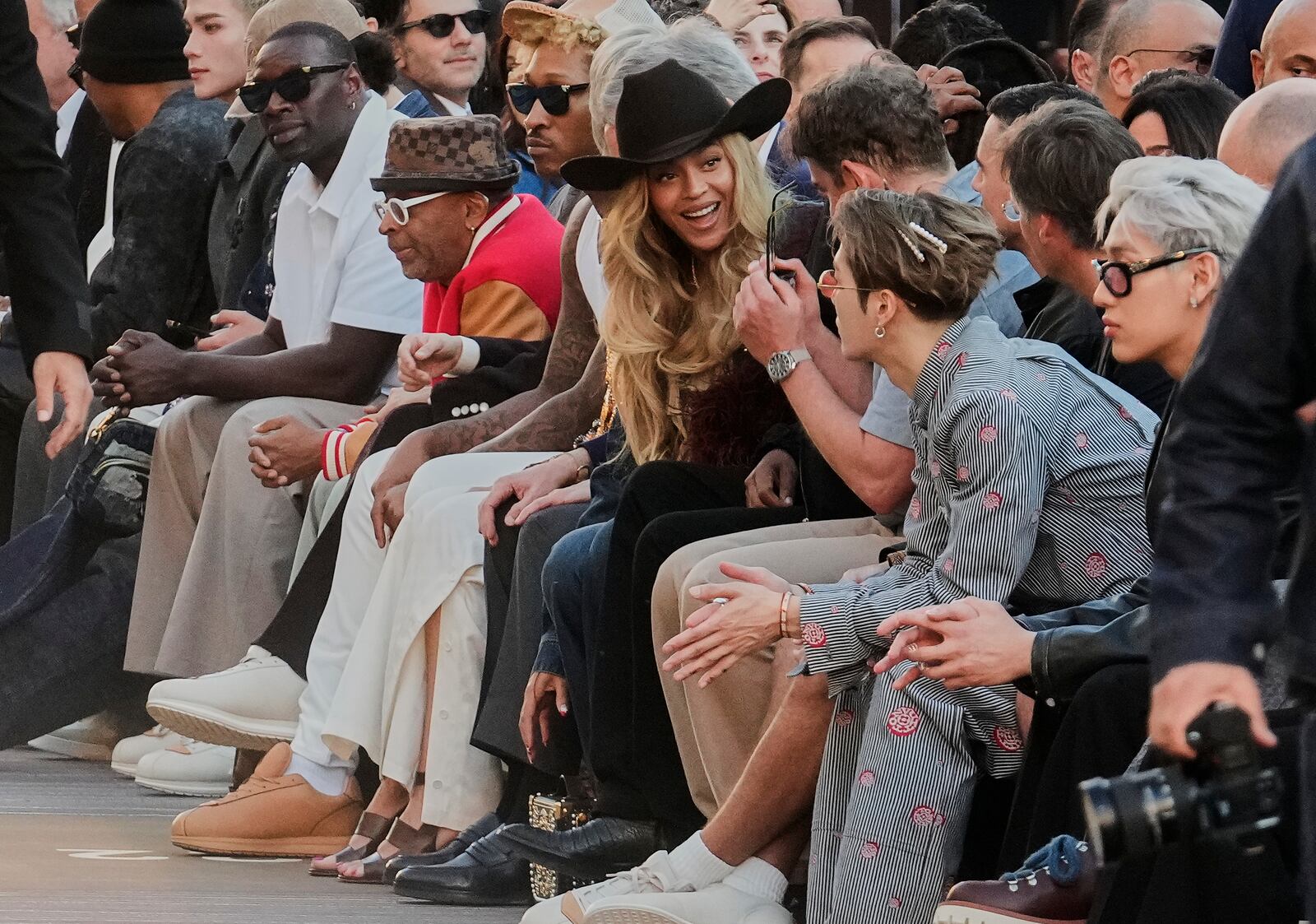 Beyonce, center, attends the men's Louis Vuitton Spring-Summer 2026 collection, that was presented in Paris, Tuesday, June 24, 2025. (AP Photo/Michel Euler)