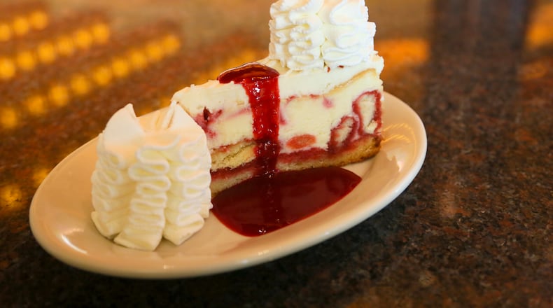 Cheesecake Factory employees work during a practice lunch session Saturday, Oct. 17, as they prepare for opening day at Liberty Center on Oct. 22. GREG LYNCH / STAFF