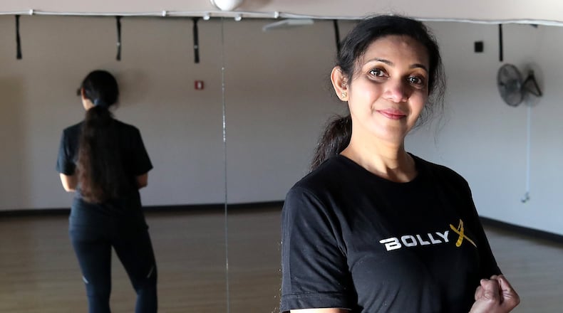 Vijaya Devatha in one of the dance poses for the Bolly X class and New Carlisle Sports and Fitness. Bill Lackey/Staff