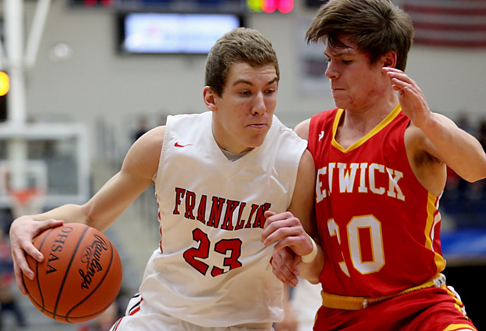 Fenwick’s John Engelmeier applies defensive pressure to Franklin’s Jared Kinzer on Saturday during a Division II sectional game at Fairmont’s Trent Arena. CONTRIBUTED PHOTO BY E.L. HUBBARD
