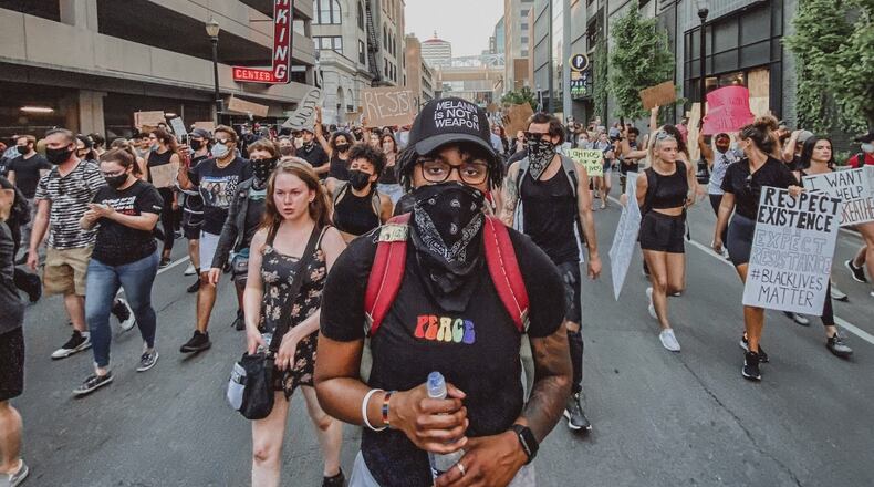 Former University of Dayton women’s basketball player JaVonna Layfield during recent protests in Louisville, Ky. CONTRIBUTED