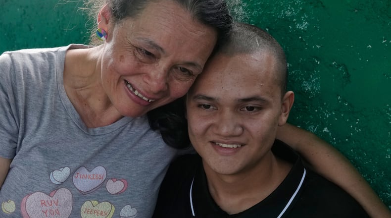 A relative embraces Diogenes Angulo after his release from prison in San Francisco de Yare, Venezuela, Saturday, Jan. 10, 2026. Angulo had been detained two days before the 2024 presidential election. (AP Photo/Ariana Cubillos)