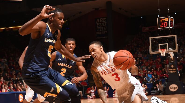 Dayton’s Kyle Davis drives past La Salle defenders during Friday night’s game at UD Arena. Contributed photo/Erik Schelkun