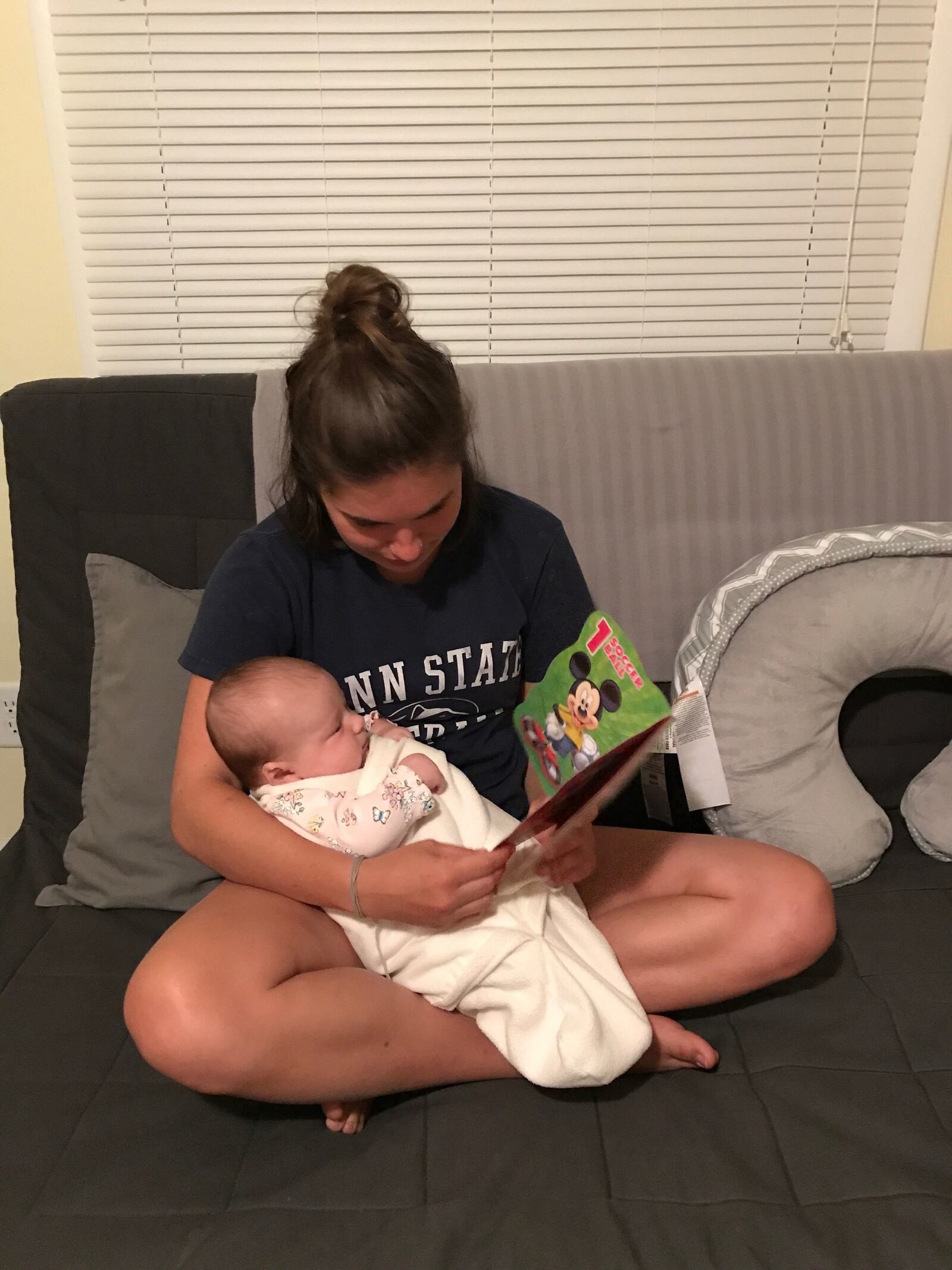 Dayton resident, Mia Szente, is read her first Imagination Library book.