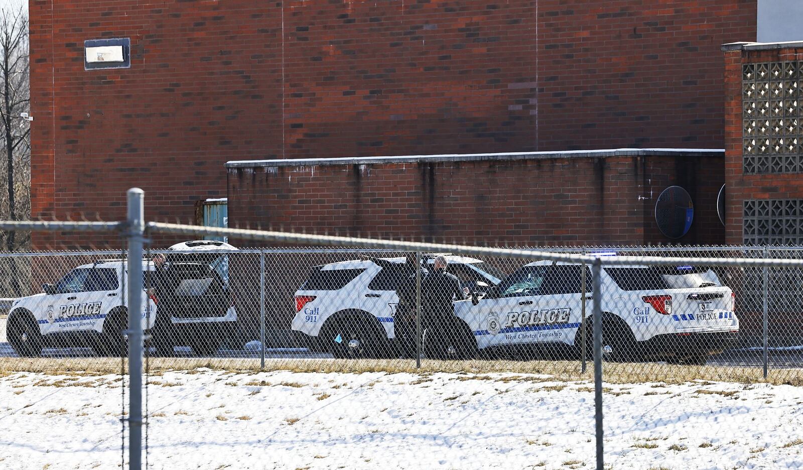 Police investigating at Walmart in West Chester Twp. Monday after a report of a male with a gun walking behind the building. NICK GRAHAM/STAFF
