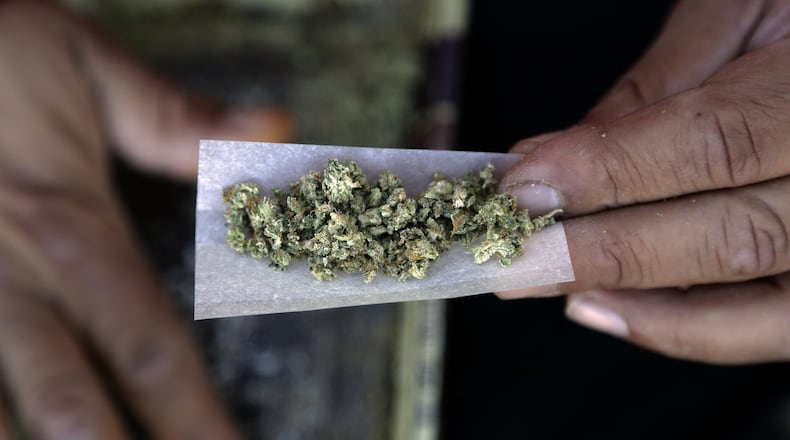 A marijuana joint is rolled. (AP Photo/Marcio Jose Sanchez)