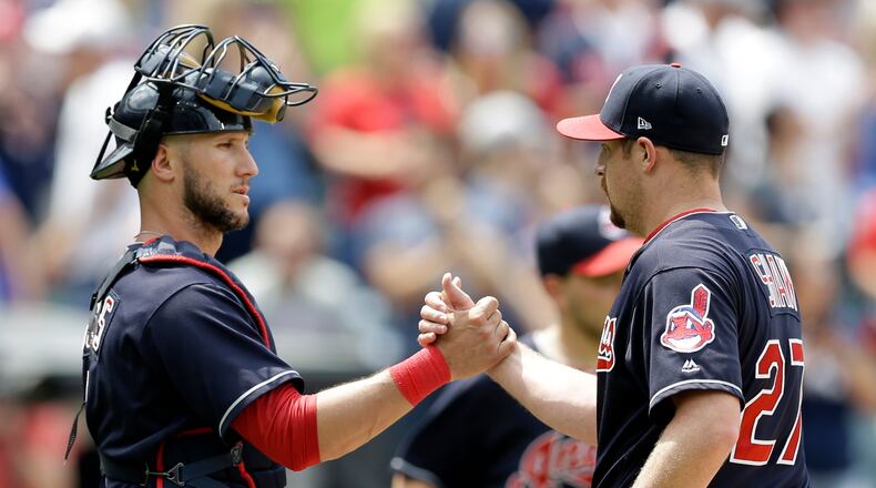 Cleveland Indians' Yan Gomes, left, and Bryan Shaw celebrate after the Indians defeated the Texas Rangers 5-1 in a baseball game, Thursday, June 29, 2017, in Cleveland. (AP Photo/Tony Dejak)