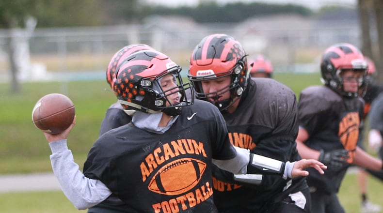 Arcanum quarterback Bryce Schondelmyer is the son of head coach Jason Schondelmyer. The undefeated Trojans face 5-1 Tri-Village on Friday night. DDN FILE PHOTO