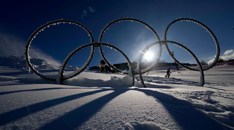 FILE - Olympic rings are displayed in the snow at the Stelvio Ski Center, venue for the alpine ski and ski mountaineering disciplines at the 2026 Milan Cortina Winter Olympics in Bormio, Italy, Jan. 16, 2025. (AP Photo/Luca Bruno, File)