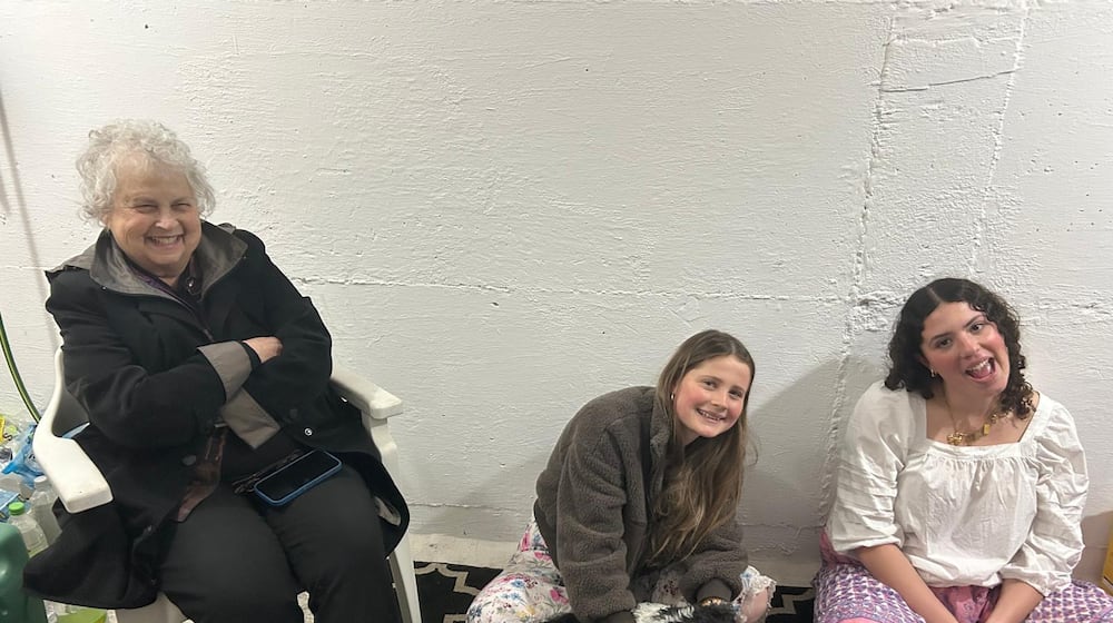 Dayton Daily News Writer Meredith Moss, left, is seen in a bomb shelter with two grand-nieces in Jerusalem March 1, 2026. They have been in the shelter about a dozen times since fighting with Iran began two days prior. CONTRIBUTED