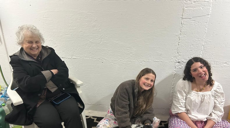 Dayton Daily News Writer Meredith Moss, left, is seen in a bomb shelter with two grand-nieces in Jerusalem March 1, 2026. They have been in the shelter about a dozen times since fighting with Iran began two days prior. CONTRIBUTED