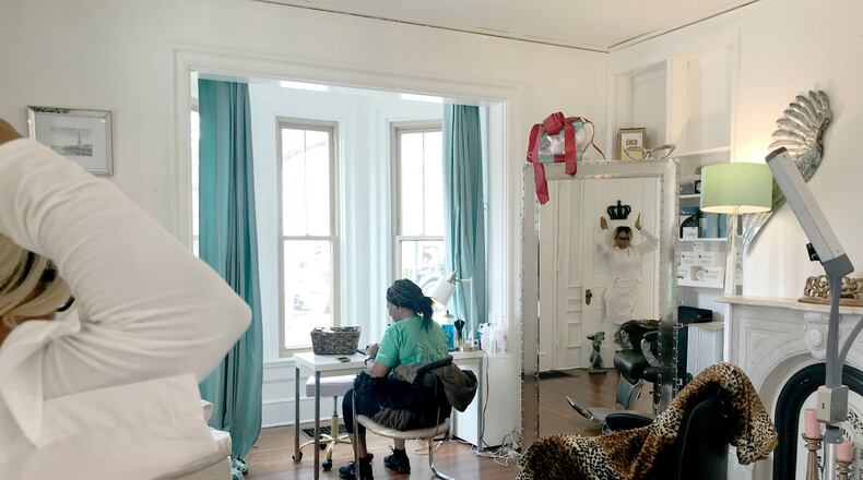 Lisa Scott ( pictured in the mirror) celebrated the grand opening of her business, Beaute Box Lashes, in its new location.