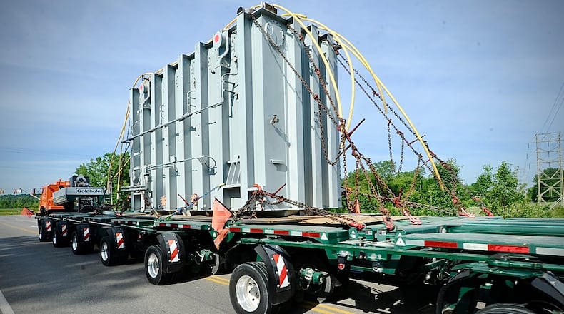 Piqua Steel Inc. moves a superload, an electronic transformer, down Treibein Road Tuesday, June 4, 2024, from the AES substation on Dayton Xenia Road to its new location at the new Honda plant in Fayette County. MARSHALL GORBY\STAFF