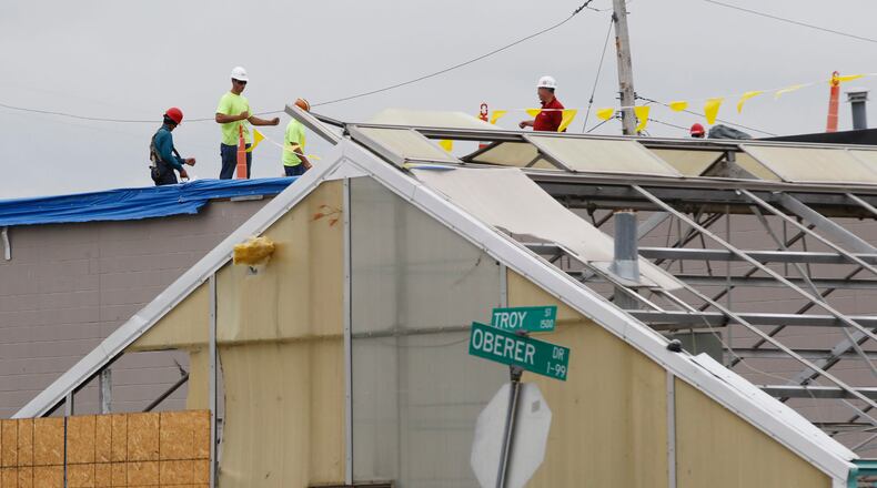 Contractors are working to repair all the damage done to Oberer’s Flowers on Troy Street in Old North Dayton. Greenhouses and warehouses of both Oberer’s and Furst Florist were hit hard by the Memorial Day tornado. TY GREENLEES / STAFF