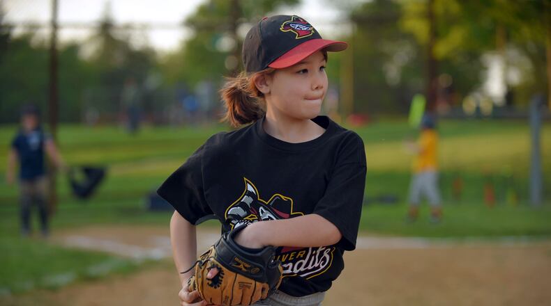 Charlie Martin, 7, takes the field during youth league baseball at Dumbarton Middle School's baseball fields. (Karl Merton Ferron/Baltimore Sun/TNS)