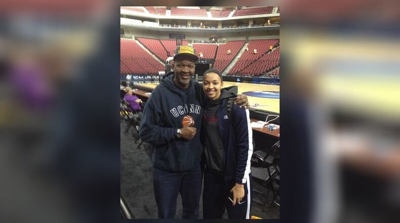 Hamilton legendary hoops star Greg Stokes poses with his daughter Kiah after a UConn basketball game.