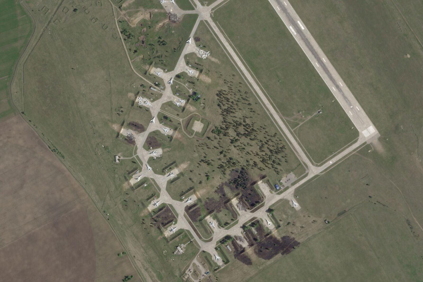 This satellite image from Planet Labs PBC shows damage after a Ukrainian drone attack targeted the Belaya Air Base in the Irkutsk region of eastern Siberia in Russia on Wednesday, June 4, 2025. (Planet Labs PBC via AP)