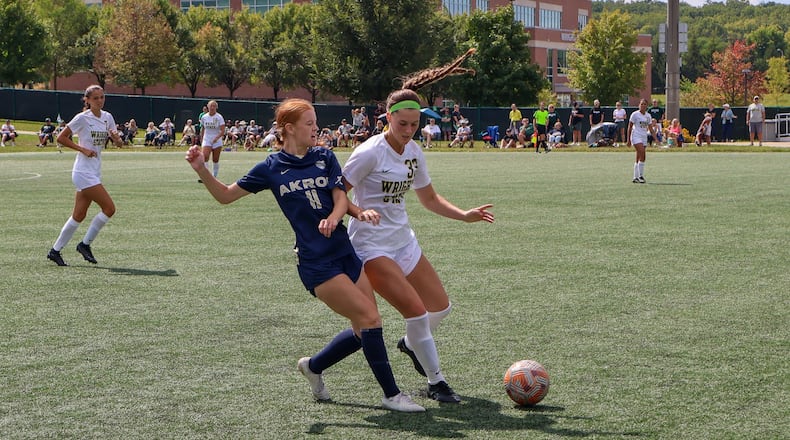 Wright State's Caitlin Burger battles Akron's Laurie-Anne Renaud for the ball during Sunday's game at Wright State. Wright State Athletics photo